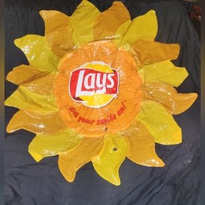 Large inflatable sun Lay's Potato chip advertisement